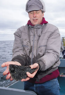 W. Hunt Howell
holds a flounder