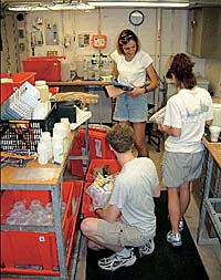 Karen Von Damm works with students aboard the R/V Atlantis