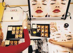 Ellen Kunes touching up photos