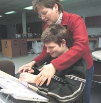 Miah using a computer with Lisa Payeur